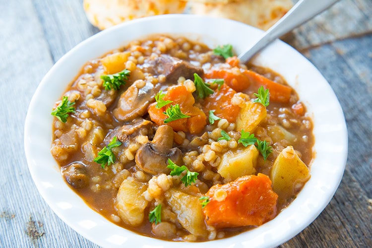   Instant Pot Beef and Barley stew in a white bowl 