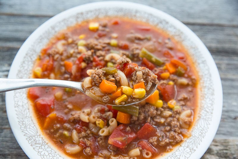 This Slow Cooker Macaroni Hamburger Soup Recipe will make everyone at the dinner table happy when it's suppertime! 