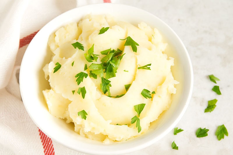 Sour cream and cream cheese truly make these the best Rich & Creamy Slow Cooker Mashed Potatoes you will ever make! Perfect for your holiday dinner!