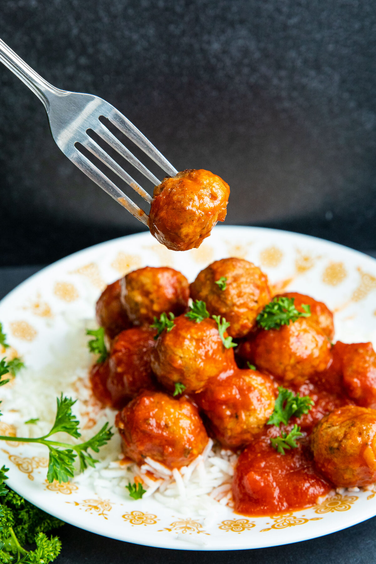 air fryer frozen meatballs, cooked on a bed of rice