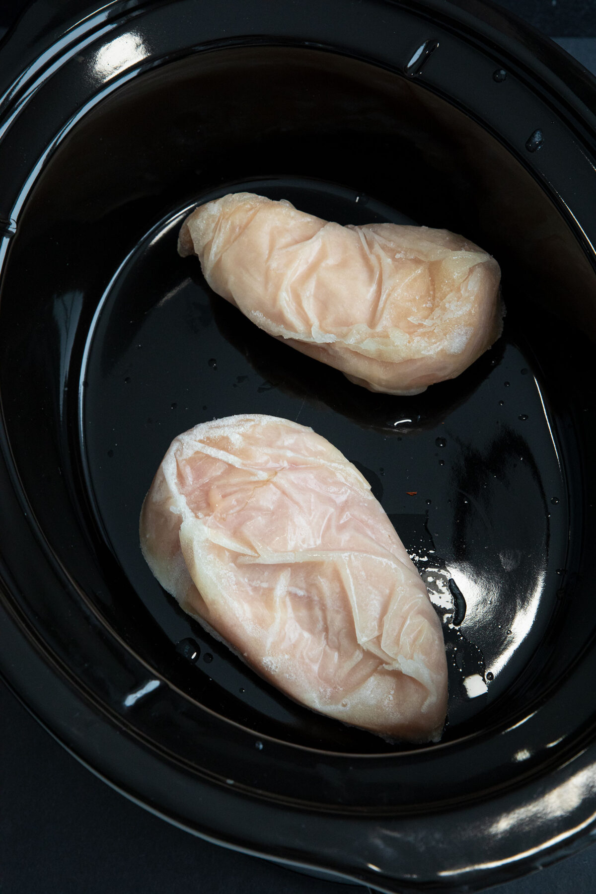 frozen chicken breasts in a slow cooker