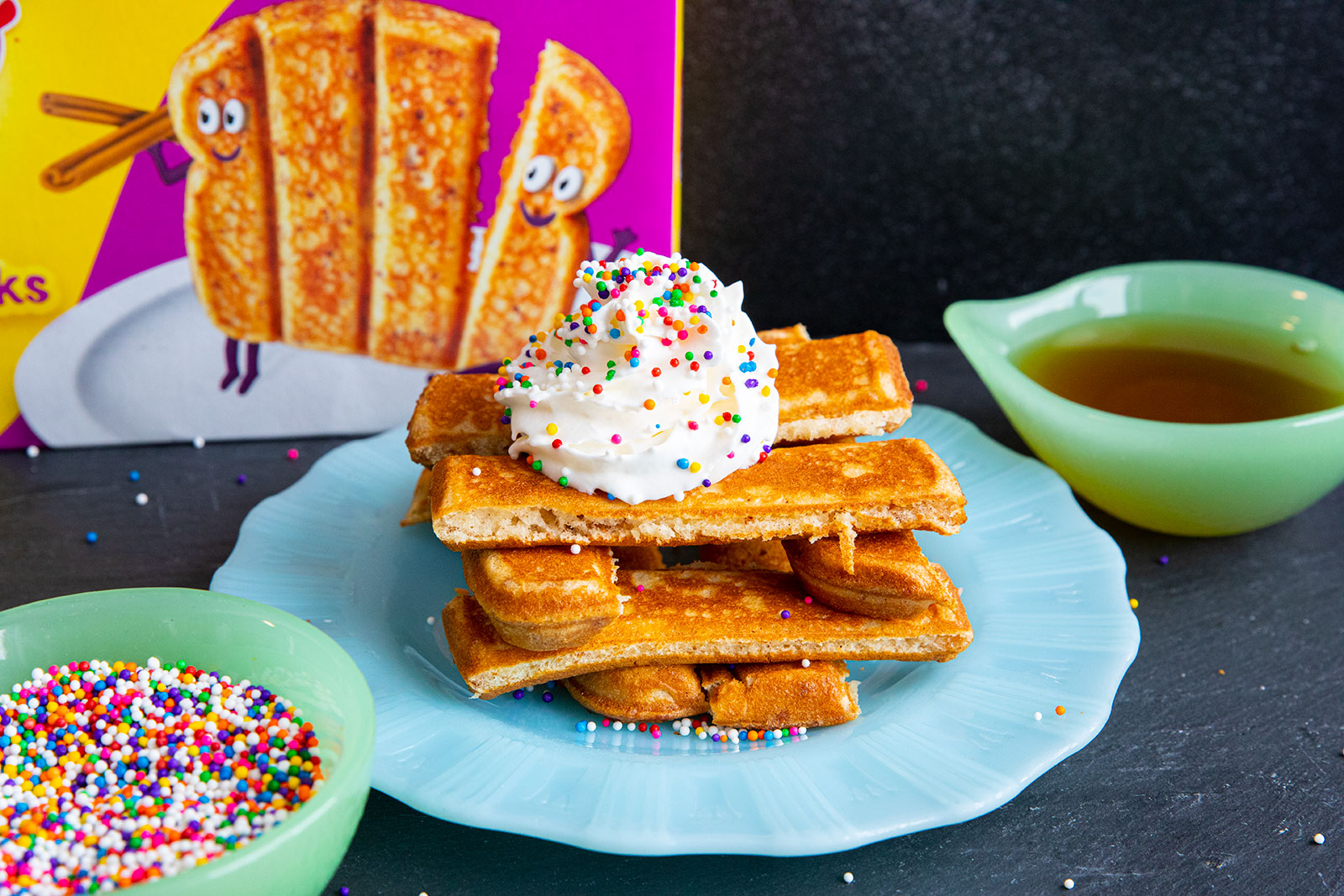 stack of French toast sticks on a blue plate.