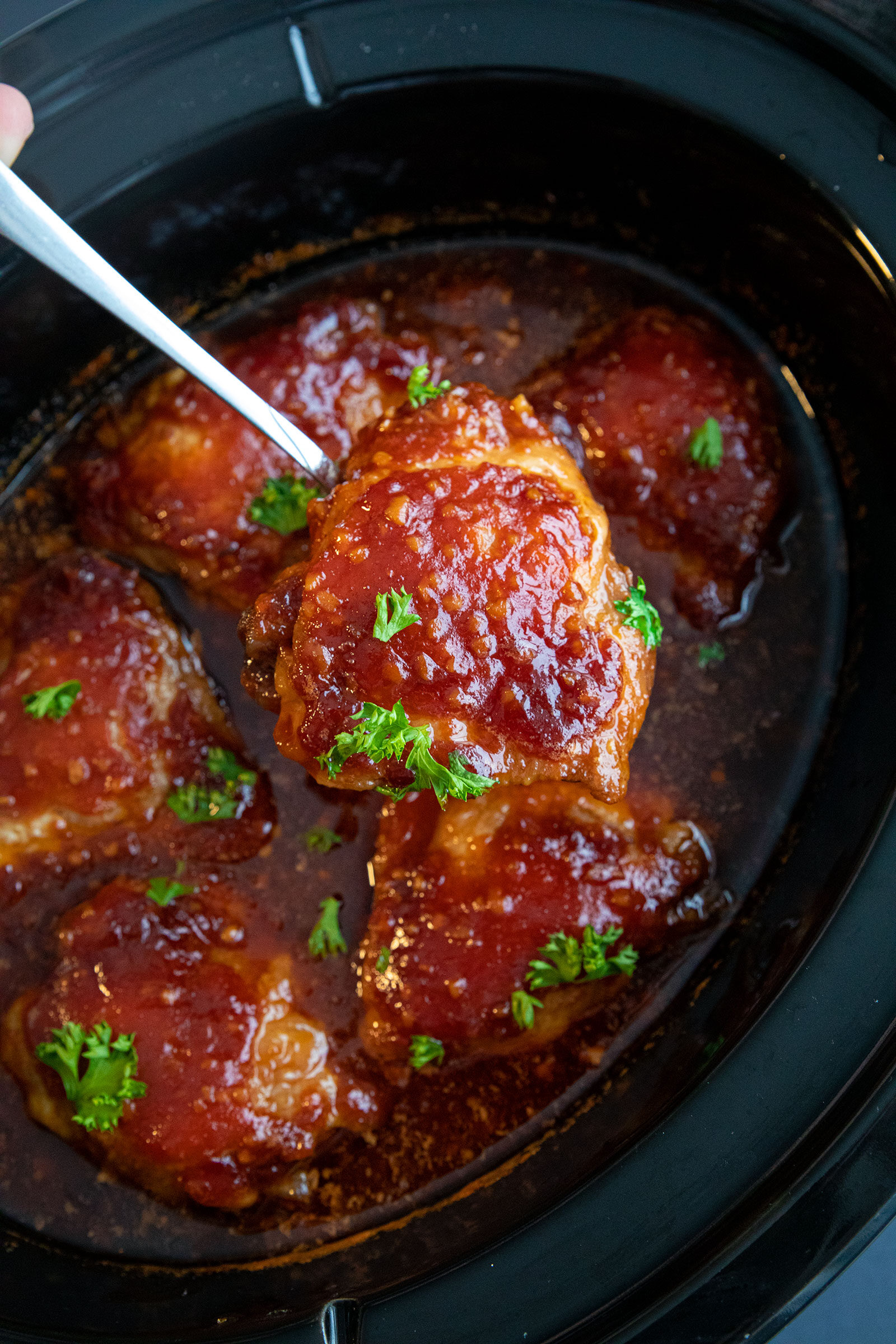 finished honey garlic chicken thighs in the slow cooker