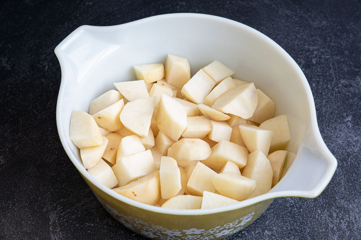 raw potatoes in a Pyrex dish