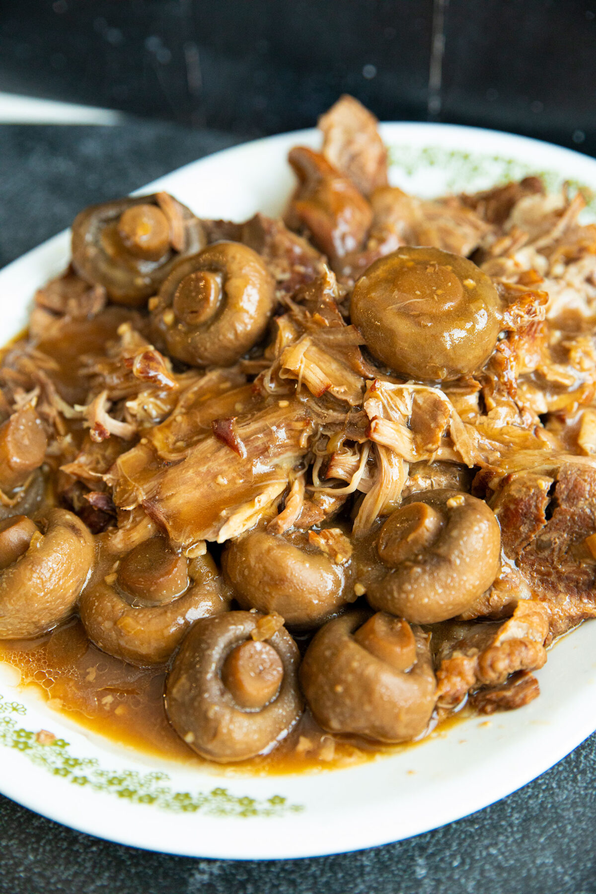 plate of shredded Instant Pot pork butt and mushrooms 