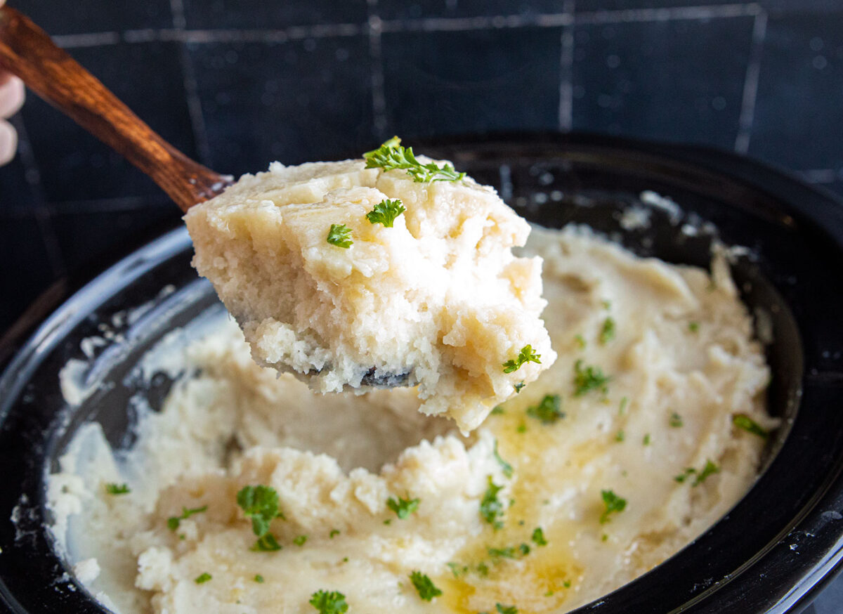 slow cooker mashed potatoes on a spoon