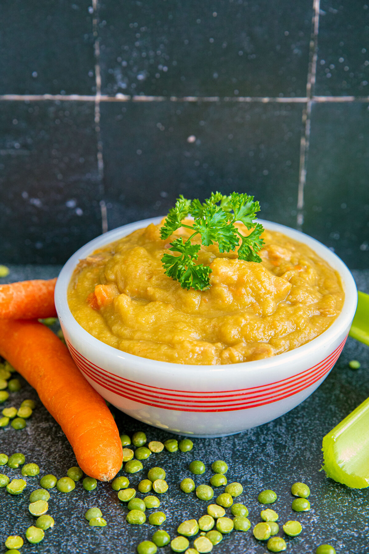 split pea soup using the ham bone in a white bowl 