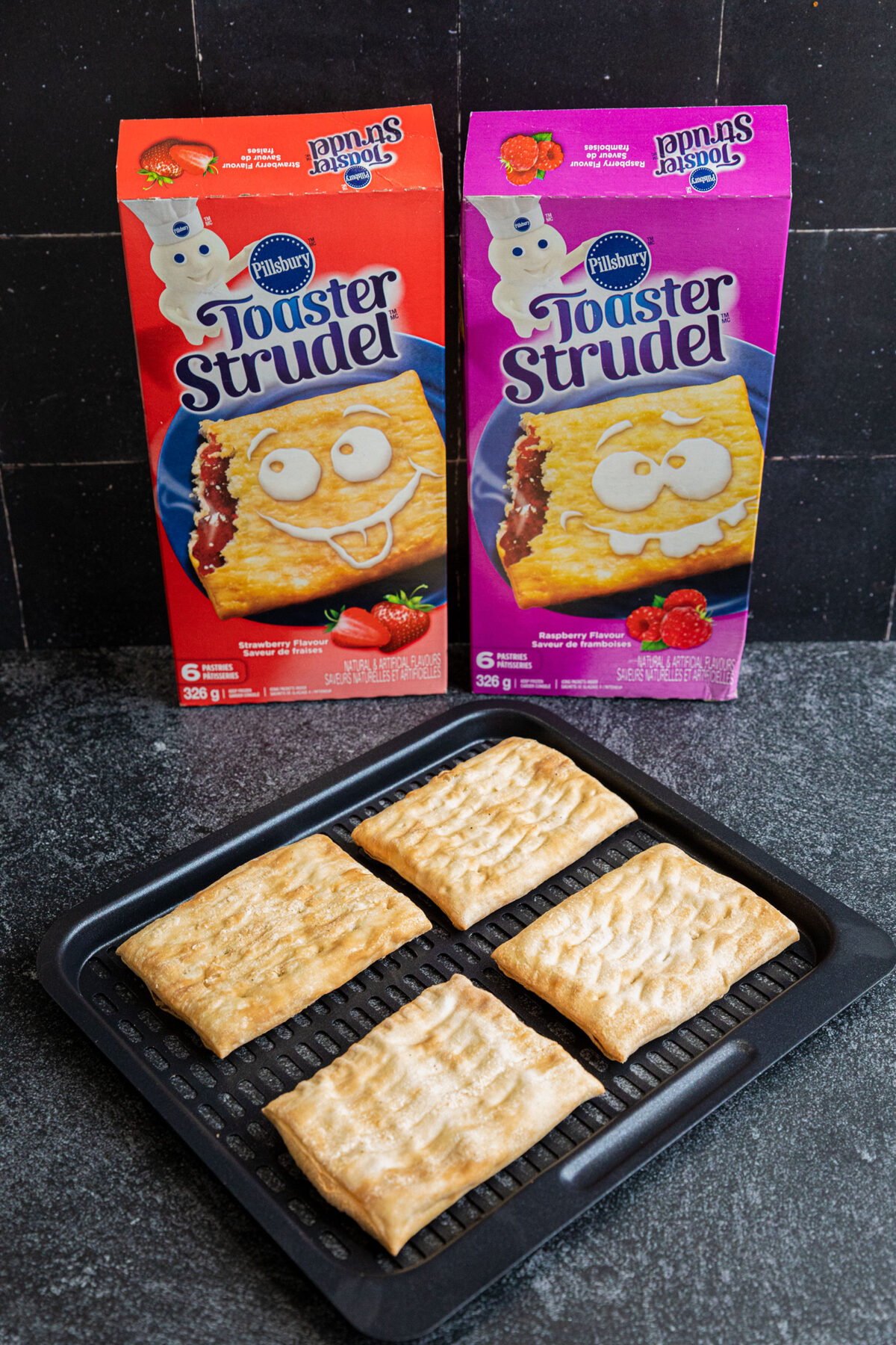 boxes of toaster strudels and frozen strudels on a baking rack 