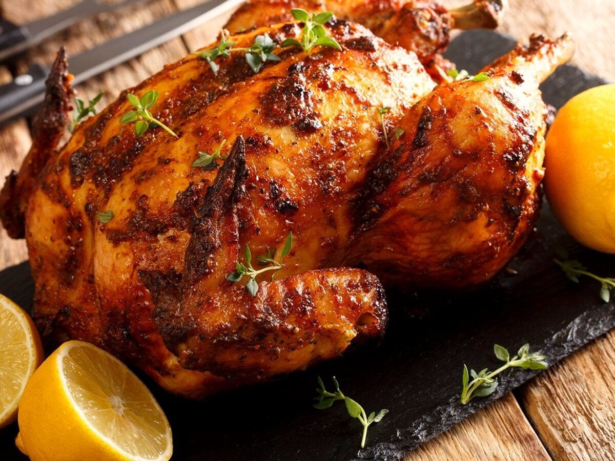 Crockpot rotisserie chicken whole on a platter